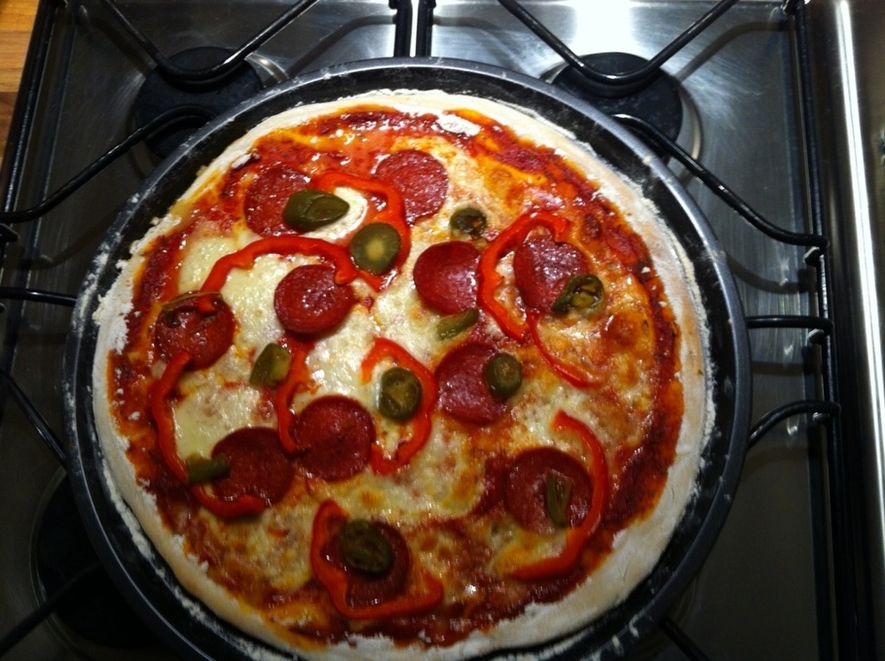 Pizza topped with Mozzarella, Pepperoni, Red Peppers & Green Jalepinos of Kelly Castledine - Recipefy