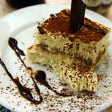 3125313360_http-upload-wikimedia-org-wikipedia-commons-8-83-tiramisu_with_cholocate_sauce_at_ferrara_in_little_italy-_new_york_city-jpg%7d