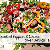 Sauteed-peppers-and-onions-over-arugula