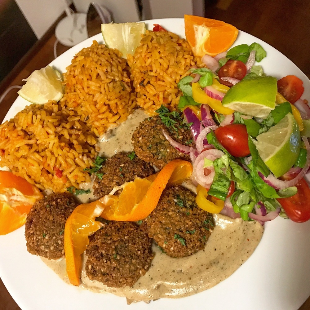 Falafel in vegan creamy pepper sauce with Mexican rice and side salad of DC5veganlifestyle - Recipefy