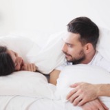 People-rest-love-relationships-and-happiness-concept-happy-couple-lying-in-bed-and-having-fun-at-home_rmqxlxv0_thumbnail-full01