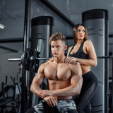 Beautiful-young-sporty-sexy-couple-showing-muscle-workout-gym-during-photoshooting_96727-529